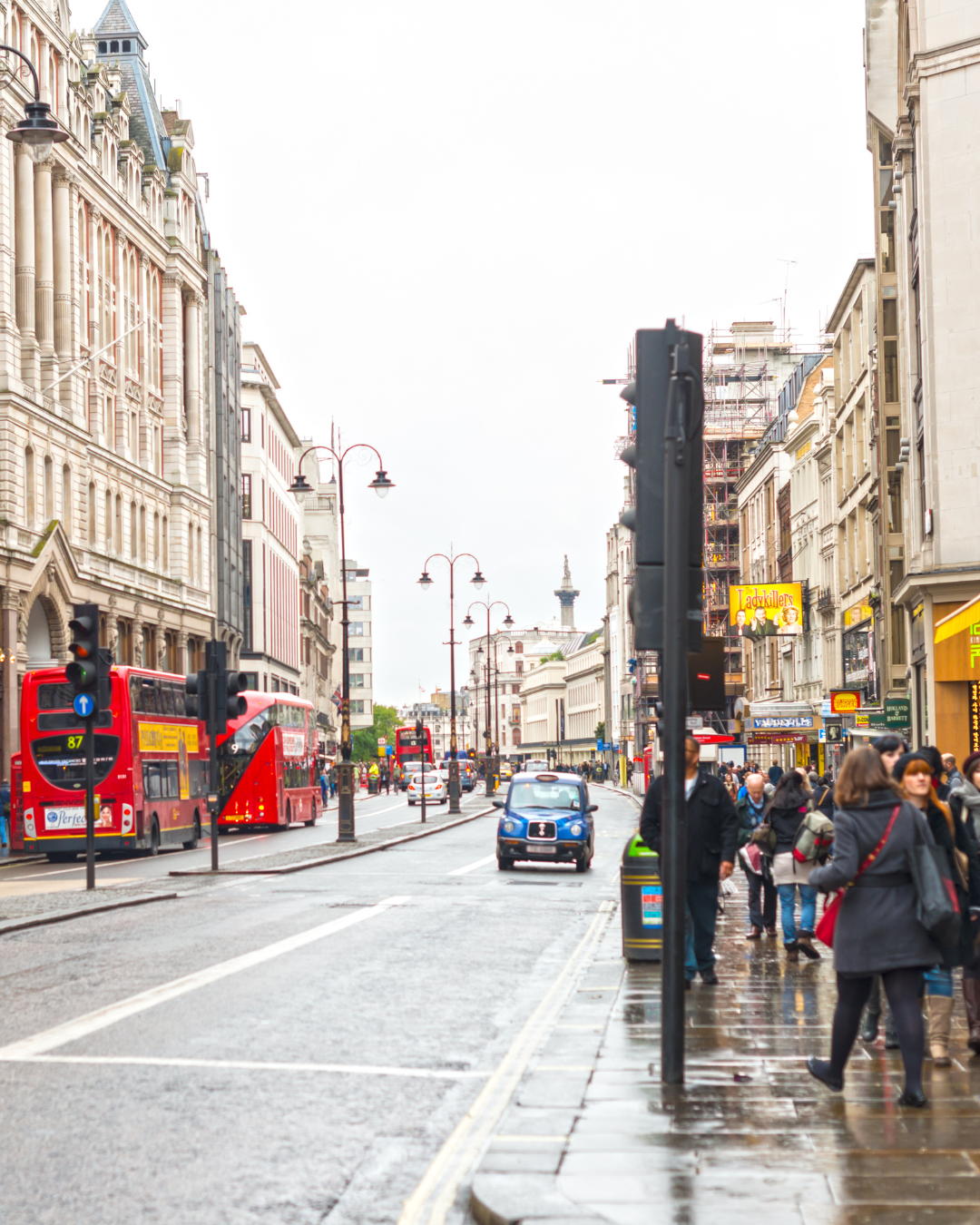 A lady working at home looking at her laptop on her desk
